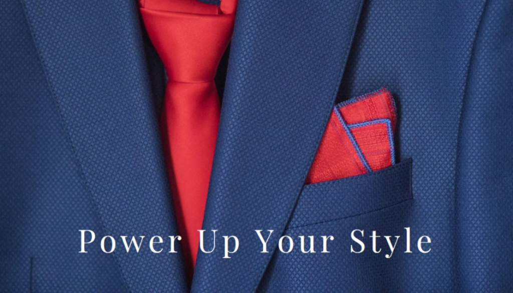 Close-up of a blue suit jacket with a red tie and pocket square, with the text “Power Up Your Style” overlaid at the bottom.