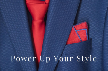 Close-up of a blue suit jacket with a red tie and pocket square, with the text “Power Up Your Style” overlaid at the bottom.