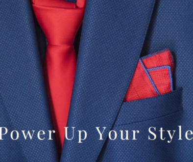 Close-up of a blue suit jacket with a red tie and pocket square, with the text “Power Up Your Style” overlaid at the bottom.