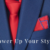 Close-up of a blue suit jacket with a red tie and pocket square, with the text “Power Up Your Style” overlaid at the bottom.